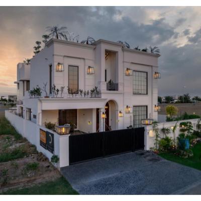 1 kanal House with 2 Floors, Partial Basement and 200 sq.ft extra covered area.